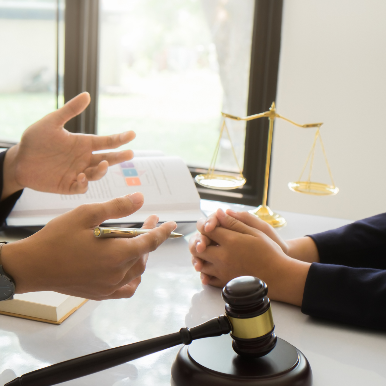 a person sitting at a table in cabo san lucas tax lawyer office